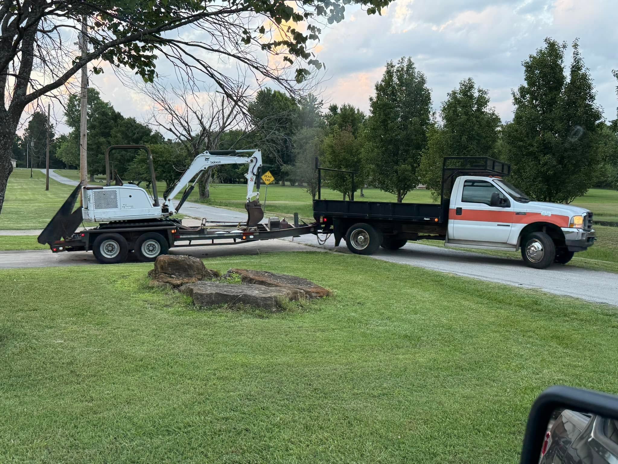 Mini excavator loaded for transport