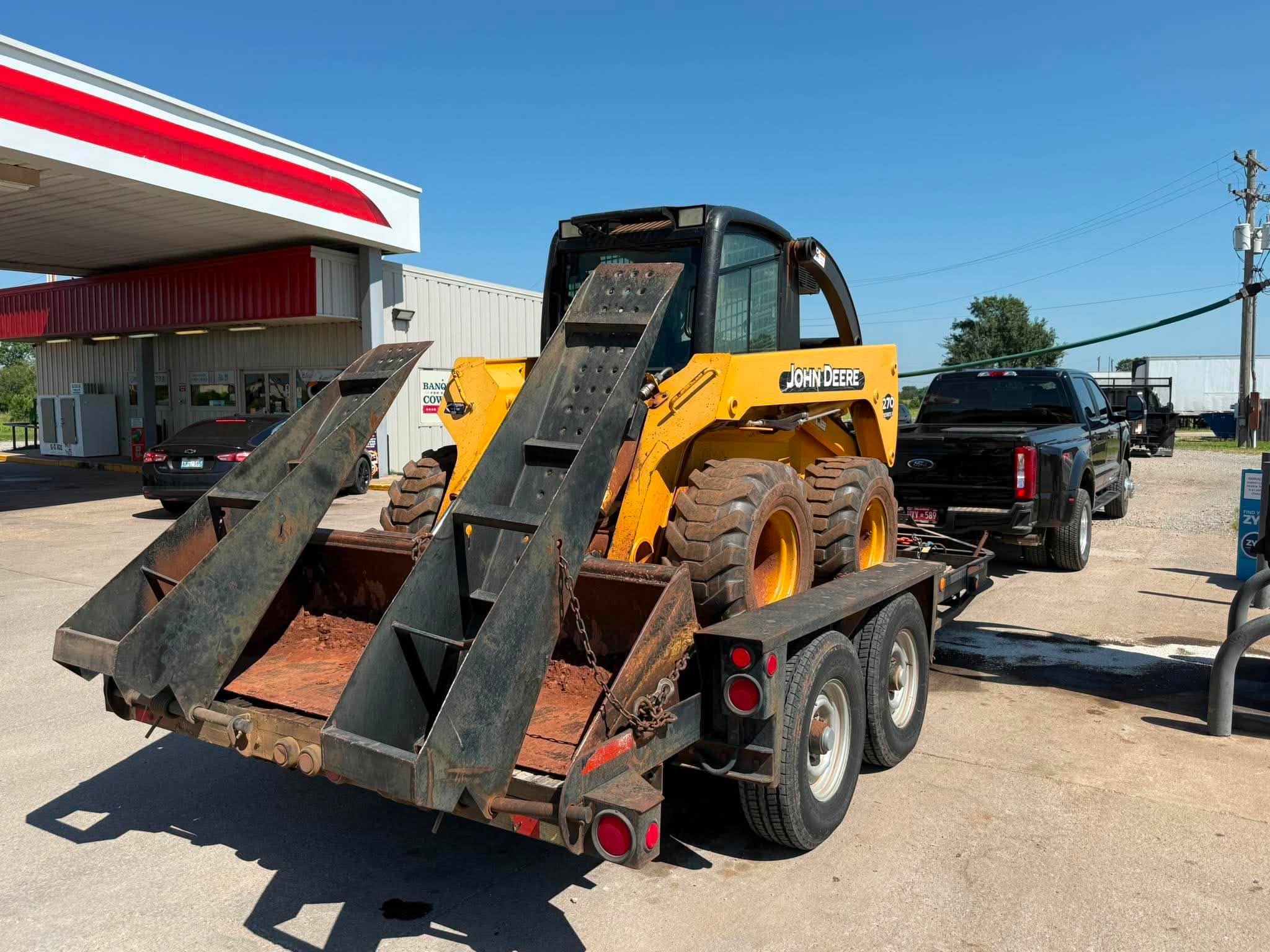John Deere skid steer — loaded and ready to roll